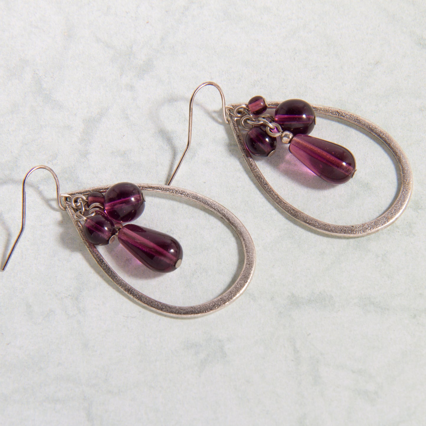 E2171-SL Open Teardrop Earrings with Purple Beads in Antiqued Silver